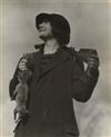 STIEGLITZ, ALFRED (1864-1946) Ida OKeeffe with rifle and squirrel.